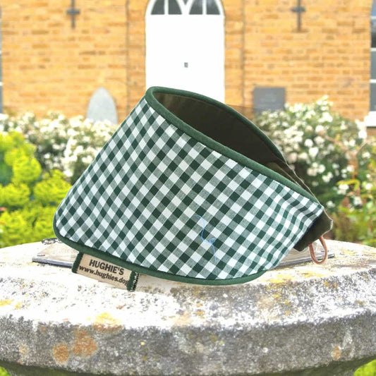British Racing Green Gingham Snap-on Dog Bandana (reversible) photographed placed on a weather dial in a country garden
