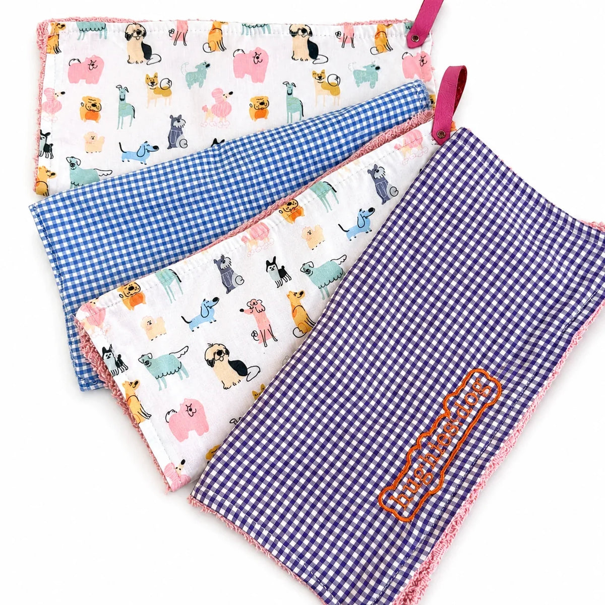Handmade Hughies dog drool cloths in gingham and playful dog prints