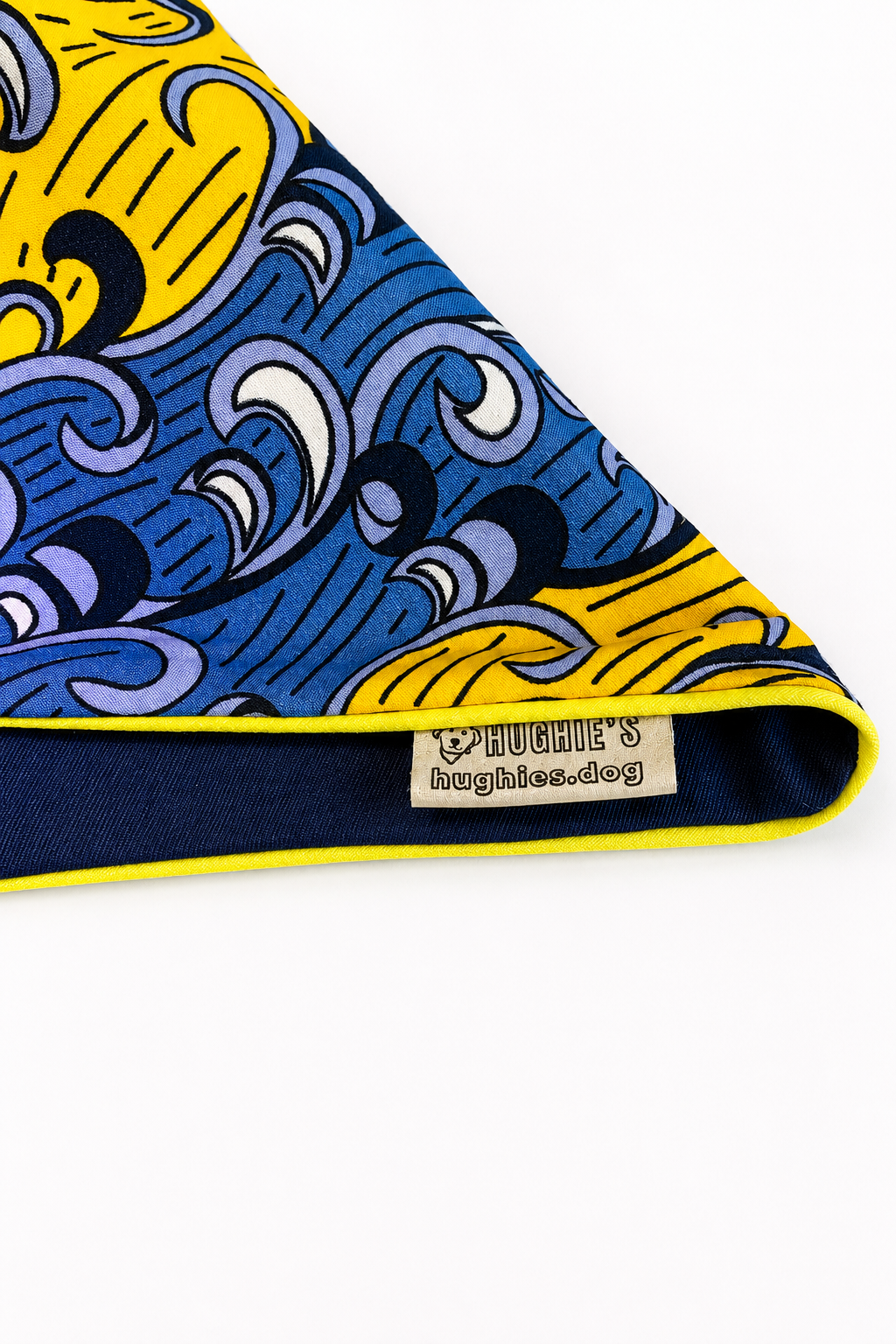Close-up of yellow and blue Ankara cotton dog bandana with navy reverse and yellow piping
