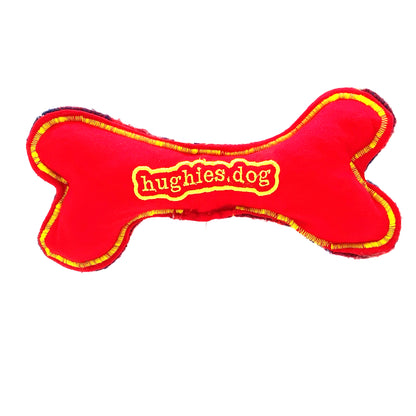 Rear of Red bone-shaped toy with 'hughies.dog' branding on a white background