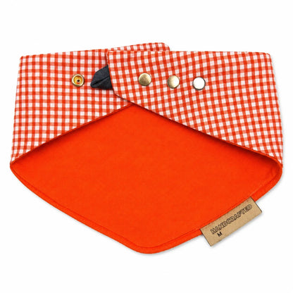 Orange gingham reversible snap-on dog bandana reverse side on white background