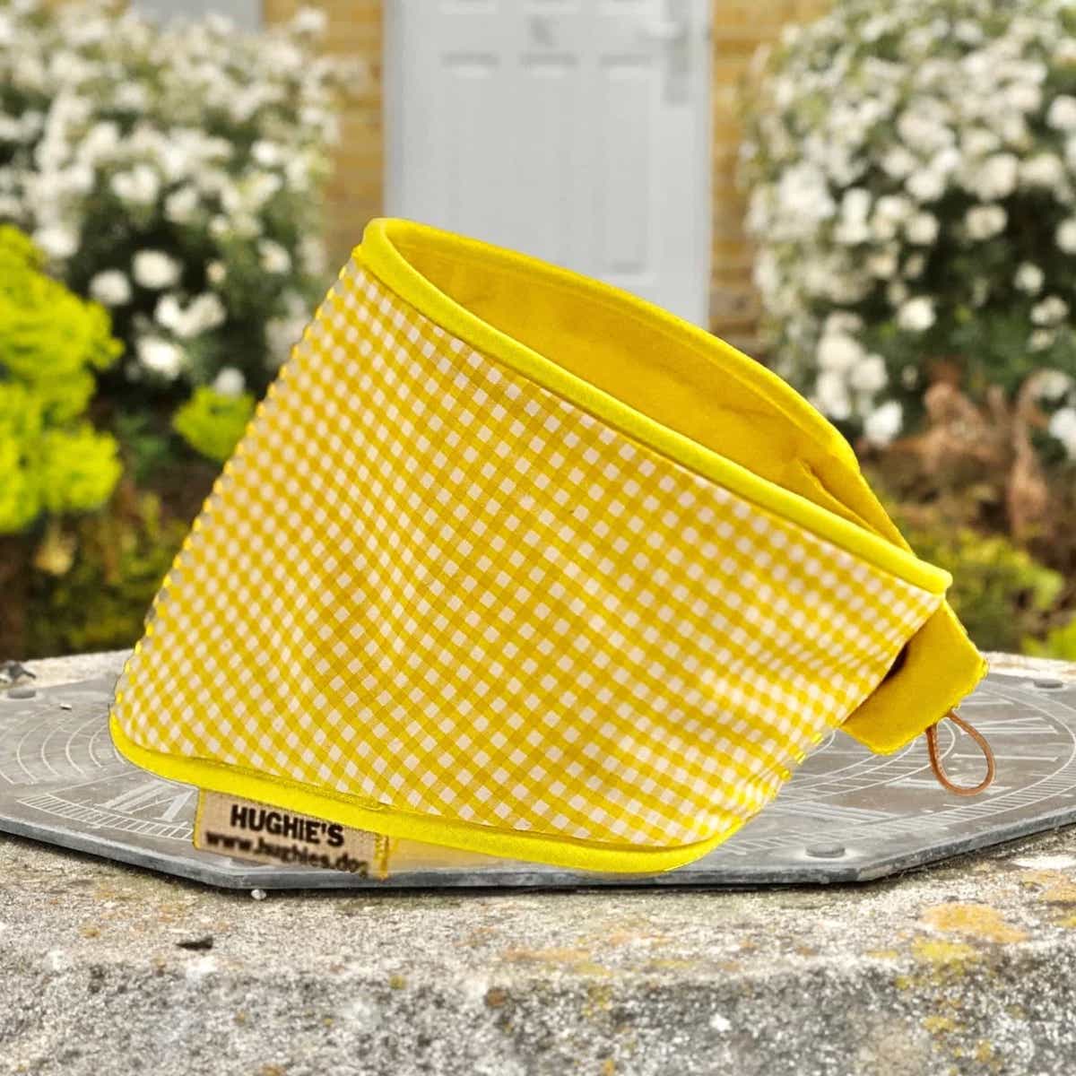yellow and white gingham snap style bandana on concrete plimpth